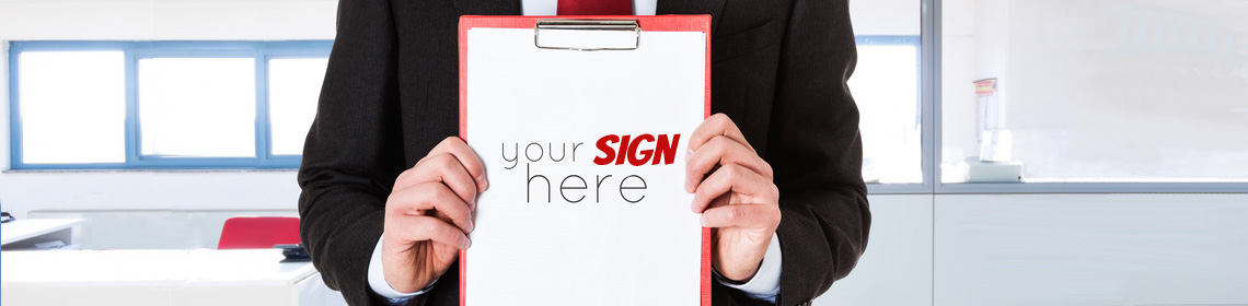 Man holding clipboard with 'Your Sign here" to signify Michigan sign company Legend